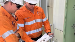 Electricians reviewing a planned preventative maintenance task